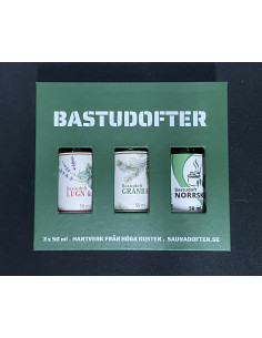 En grön ask med tre stycken flaskor med olika bastudofter 2